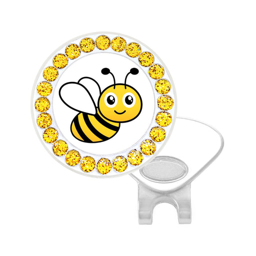Golf ball marker with bee design and yellow rhinestones on a white background
