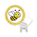 Golf ball marker with bee design and yellow rhinestones on a white background