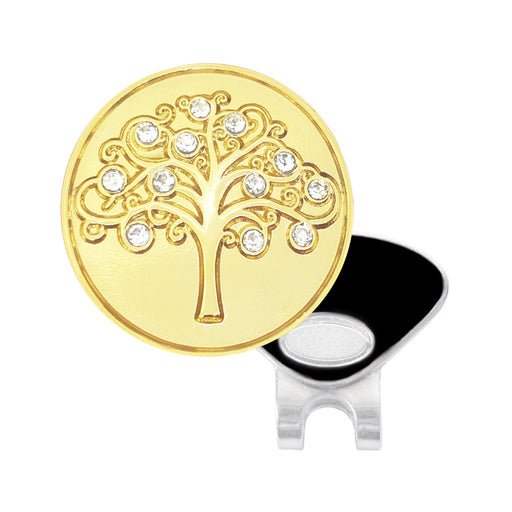 Gold tree-shaped disc with embedded crystals and a black and silver clip on a white background
