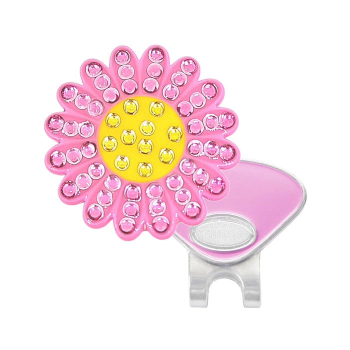A pink sunflower with swarovski  embellished petals, a yellow center, and a silver metal clip on a white background